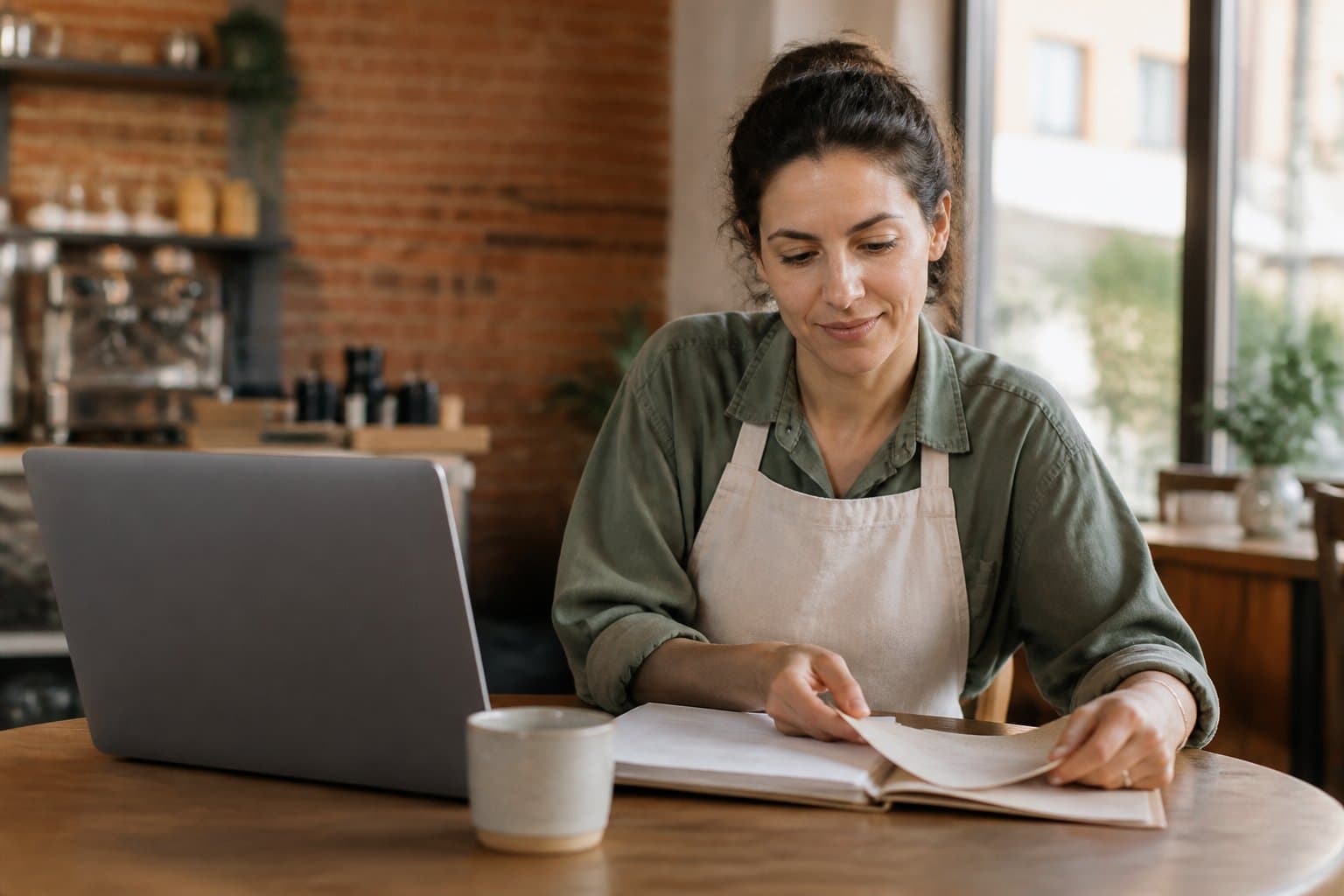 A small-business owner going through her books